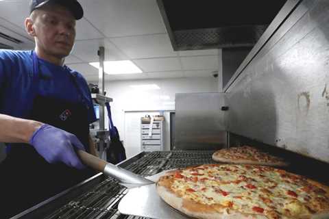 Domino's Pizza considers selling Russian business - BBC