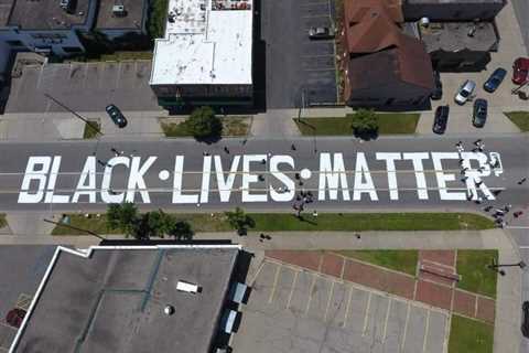 A Michigan city stopped people from repainting a Black Lives Matter street mural, claiming it posed ..